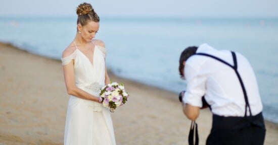 A bride has revealed how she accidentally ruined her wedding photos in a viral TikTok video because she didn’t “soft smile” — but some viewers are blaming her photographer.